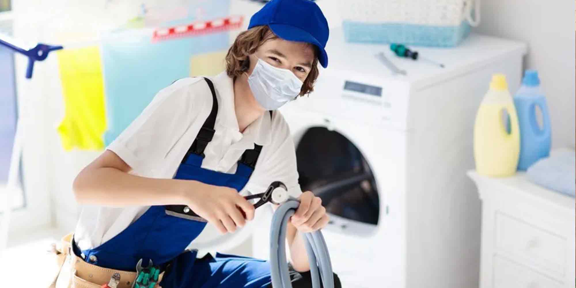 Technician Working on Washing Machine | Monkey Wrench Plumbing, Sewer & Drain | Best Plumber Near Millcreek Utah | Expert Plumbing Utah
