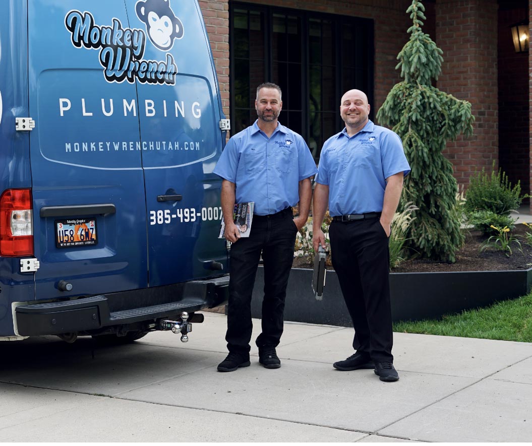 Monkey Wrench Plumbing Sewer and Drain Owners Chris and Master Plumber Wes - Salt Lake City- Two service men standing