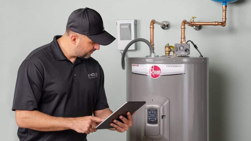 RHEEM TANK WATER HEATER being serviced by Monkey Wrench Plumbing a Rheem Pro partner in Utah