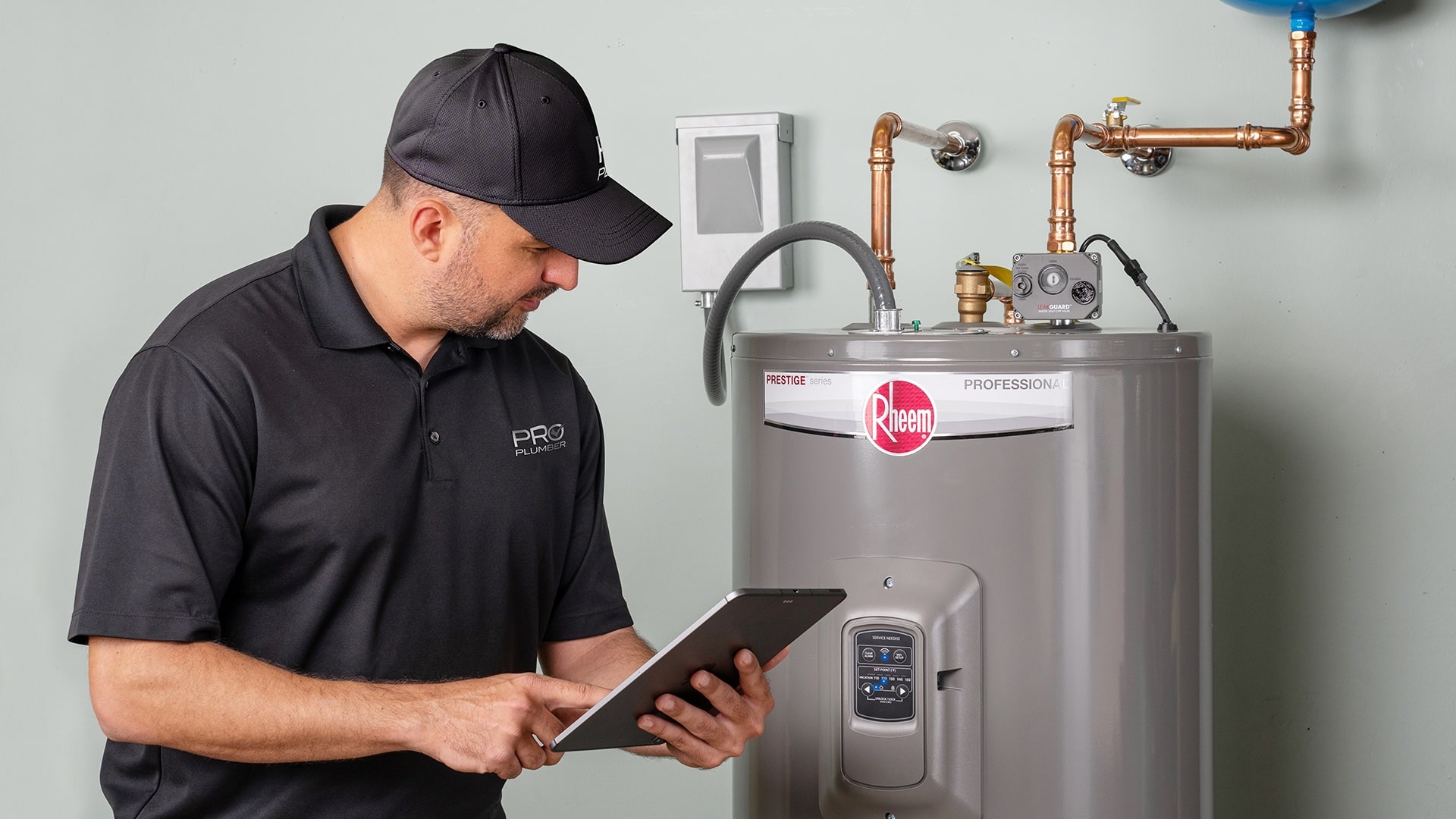 RHEEM TANK WATER HEATER being serviced by Monkey Wrench Plumbing a Rheem Pro partner in Utah
