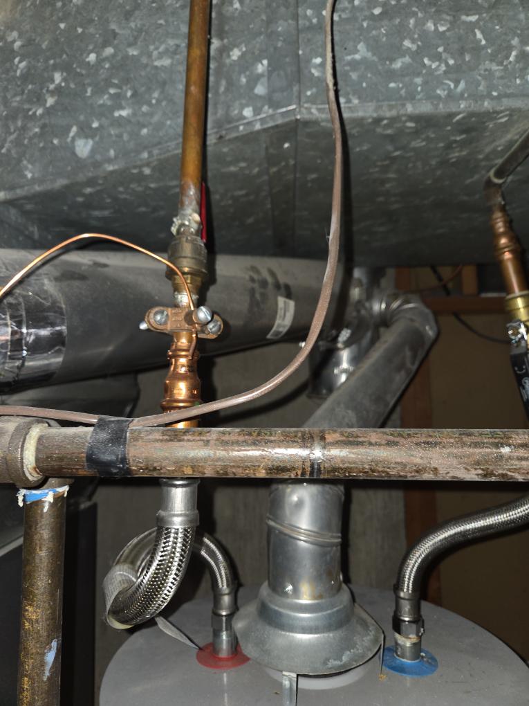 Improperly installed water heater with disconnected vent pipe